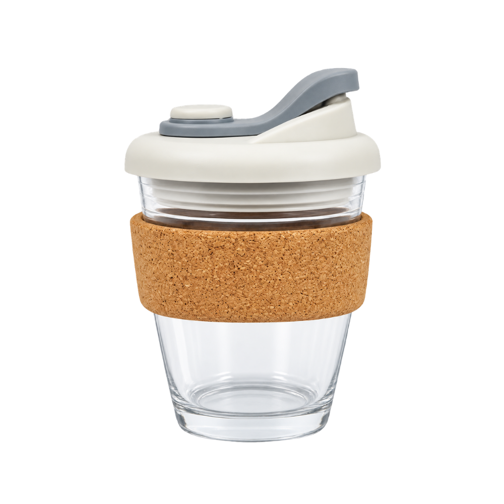 A clear glass reusable coffee cup with a natural cork band and a cream and grey flip-top lid, presented on a white background.