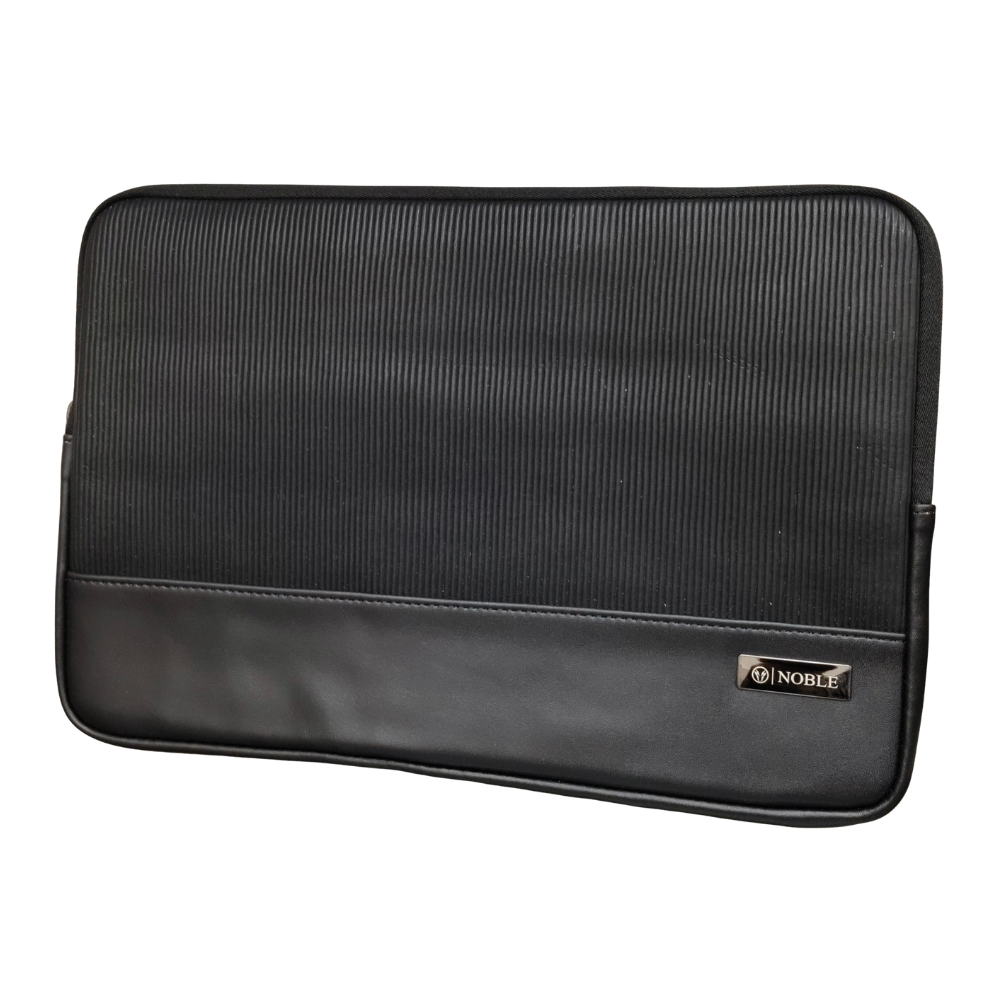 A charcoal grey minimalist laptop sleeve with a smooth matte finish isolated on a white background.