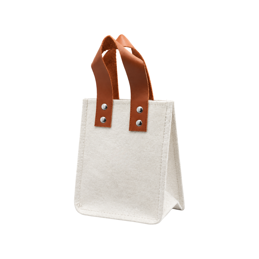 A beige felt tote bag with brown leather handles and silver rivets, isolated on a white background.
