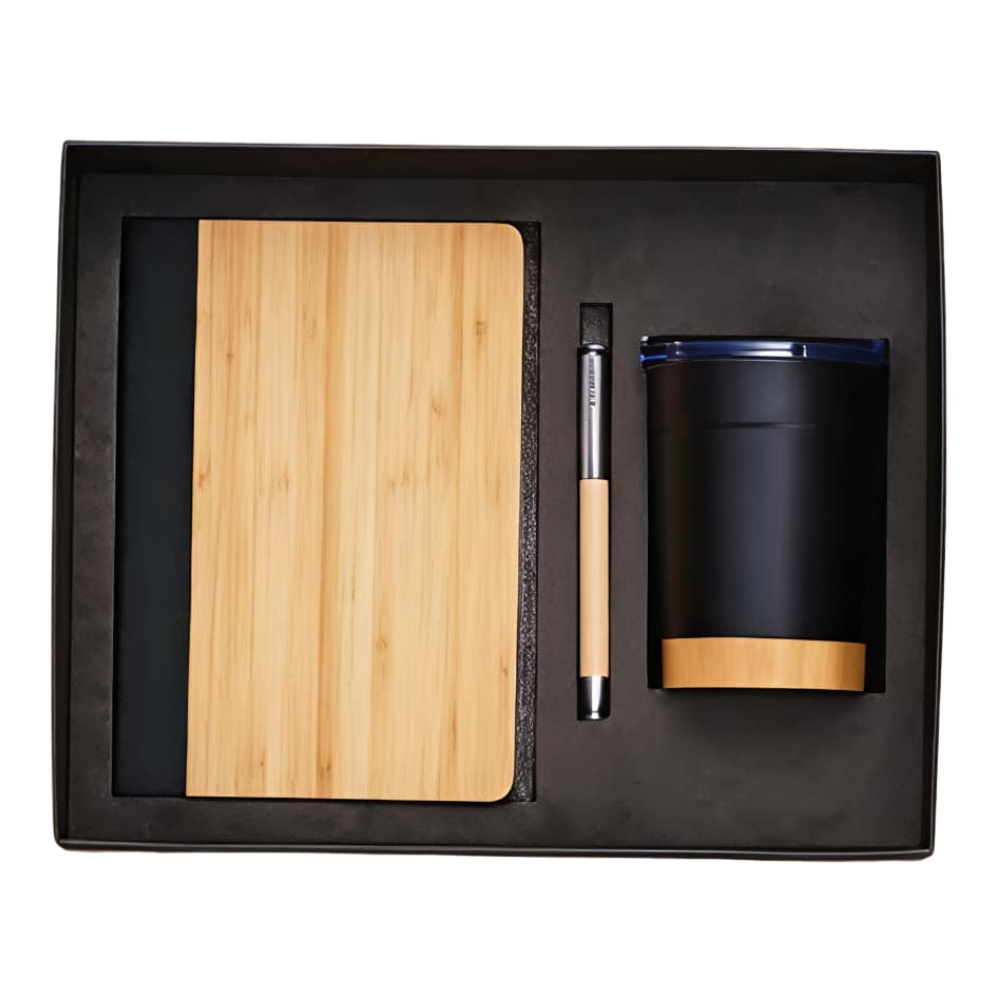 Top-down view of an executive gift set containing a bamboo notebook, a bamboo pen, and a black tumbler in a black presentation box.