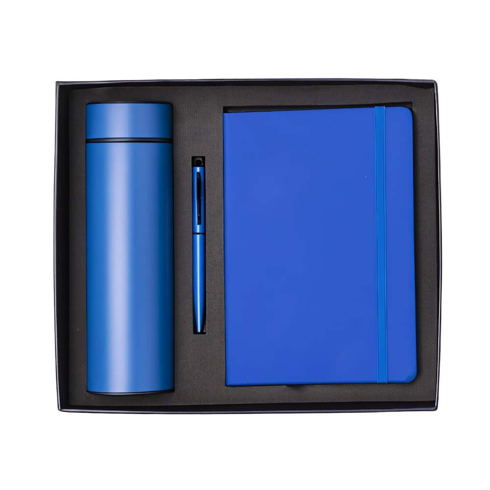 Top-down view of a royal blue executive gift set in a black box, containing a vacuum bottle, a ballpoint pen, and a notebook.