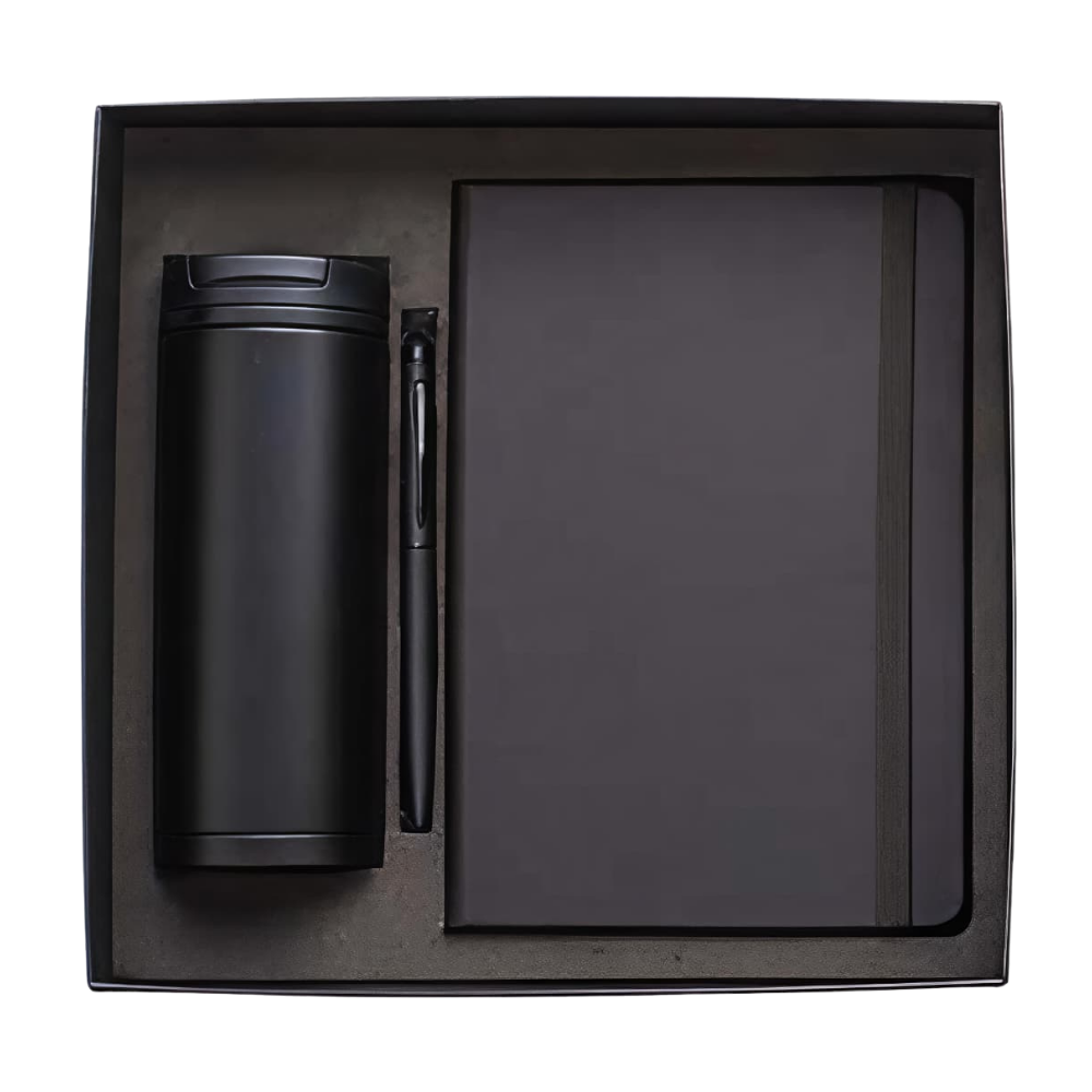 Top-down view of a matte black corporate gift set containing a vacuum bottle, notebook, and pen in a presentation box.
