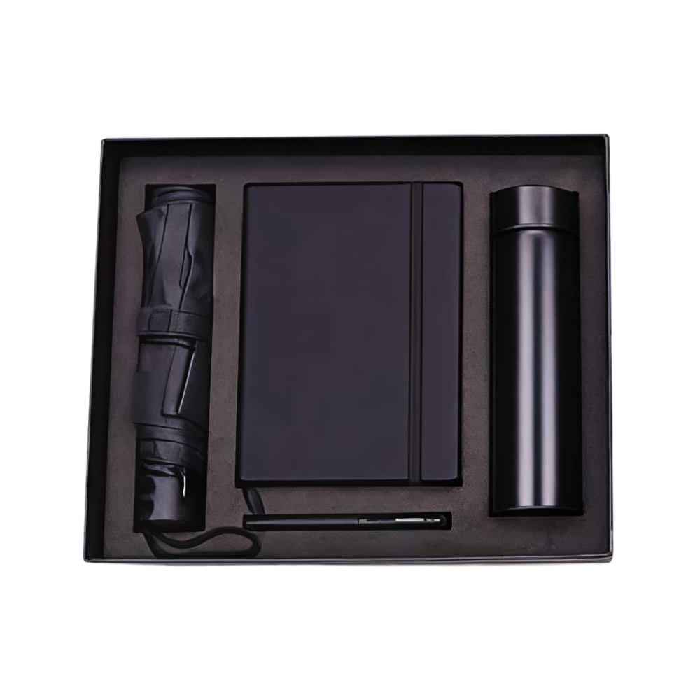 A professional 3-piece corporate gift set in a black presentation box, containing a matte black vacuum bottle, notebook, and pen.