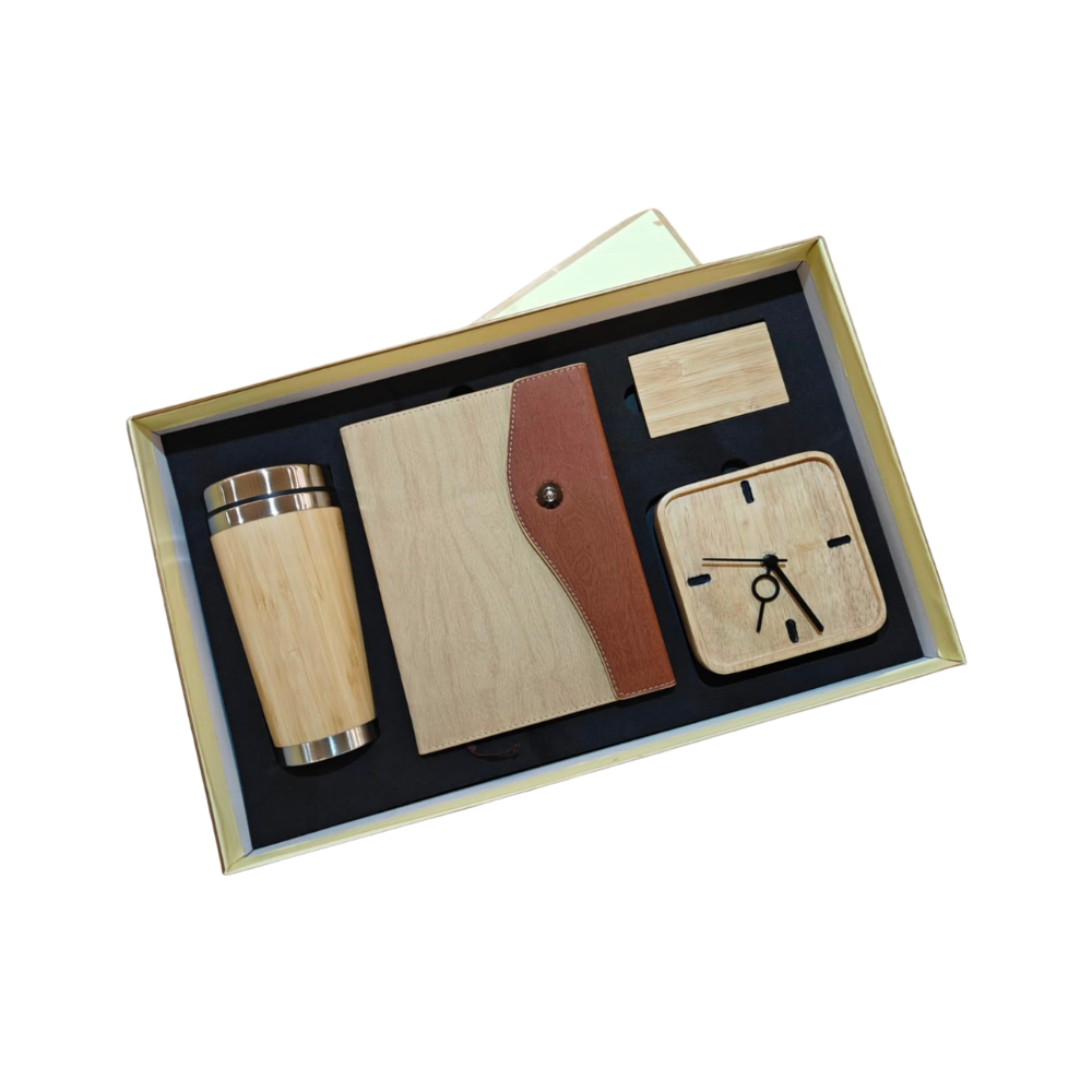 A premium executive gift set containing a bamboo tumbler, notebook, clock, and card holder in a presentation box.