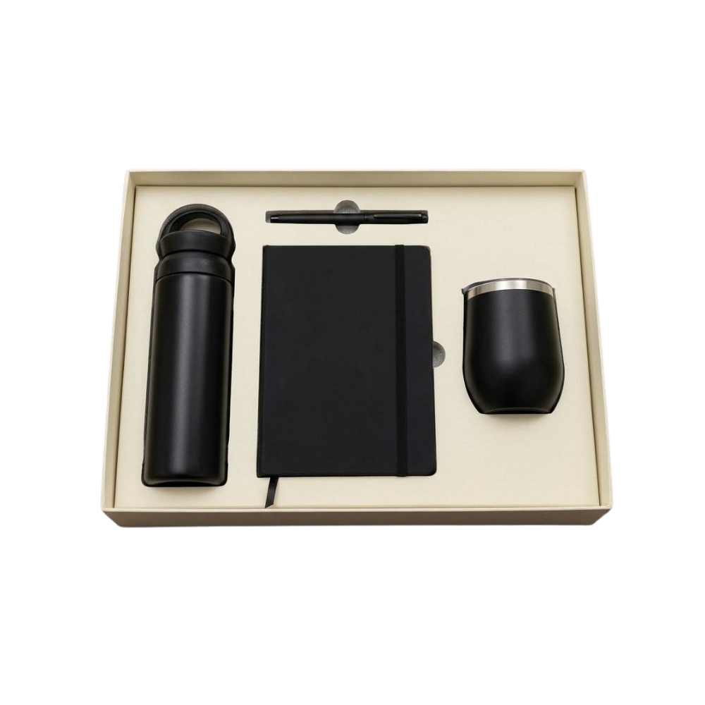 A 3-piece corporate gift set in a beige box containing a matte black vacuum bottle, wine tumbler, notebook, and pen.