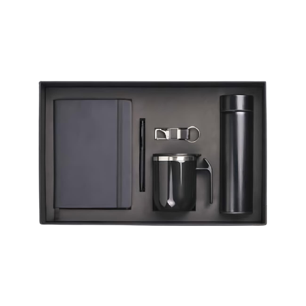 A professional 4-piece corporate gift set in a charcoal box, containing a matte black notebook, pen, mug, and vacuum bottle.