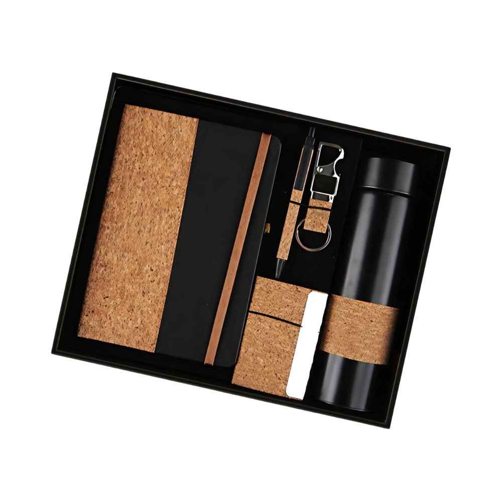 A premium corporate gift set in a black box containing a cork-accented notebook, a matte black vacuum bottle, a pen, and a keychain.