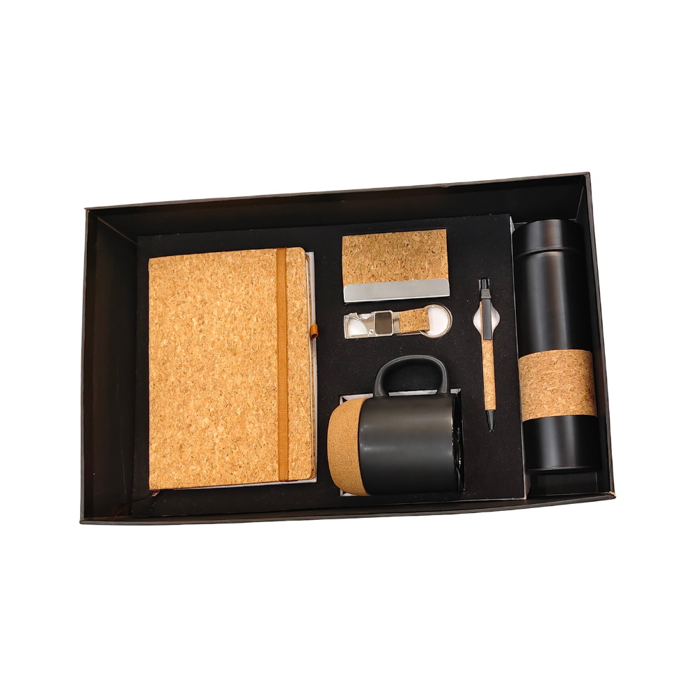 A premium corporate gift set in a black box containing a cork notebook, mug, vacuum bottle, pen, and business card holder.