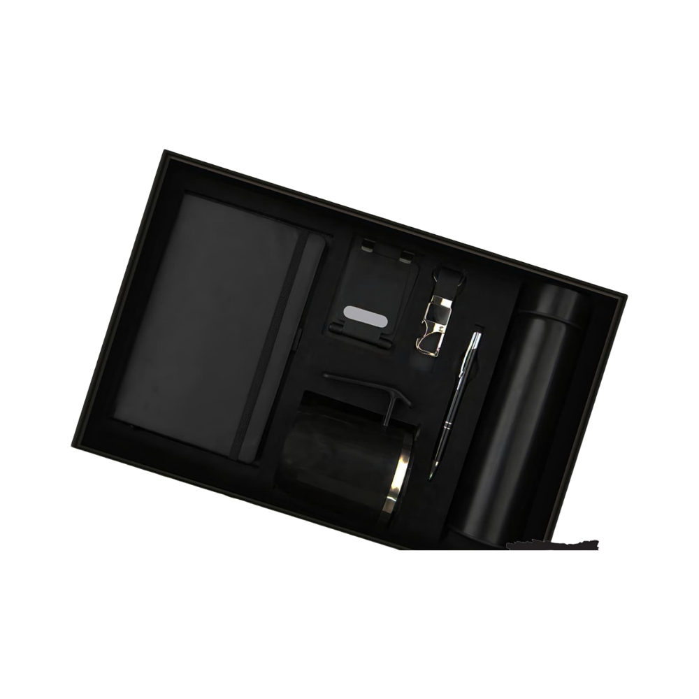 A 5-piece executive gift set in a black box, containing a notebook, vacuum bottle, mug, pen, and keychain, all in matte black.
