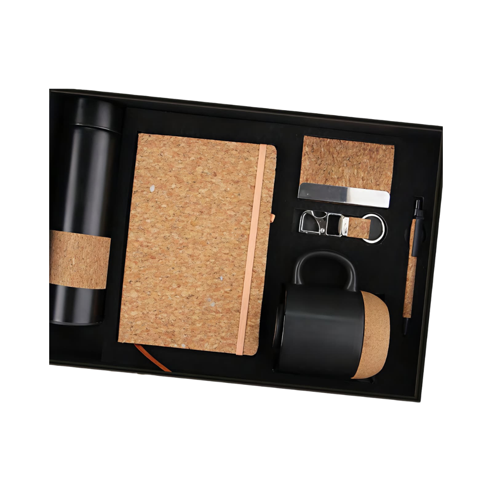 A premium 5-piece corporate gift set in a black box, featuring a matte black vacuum bottle, cork notebook, black mug with cork base, cork pen, and keychain.