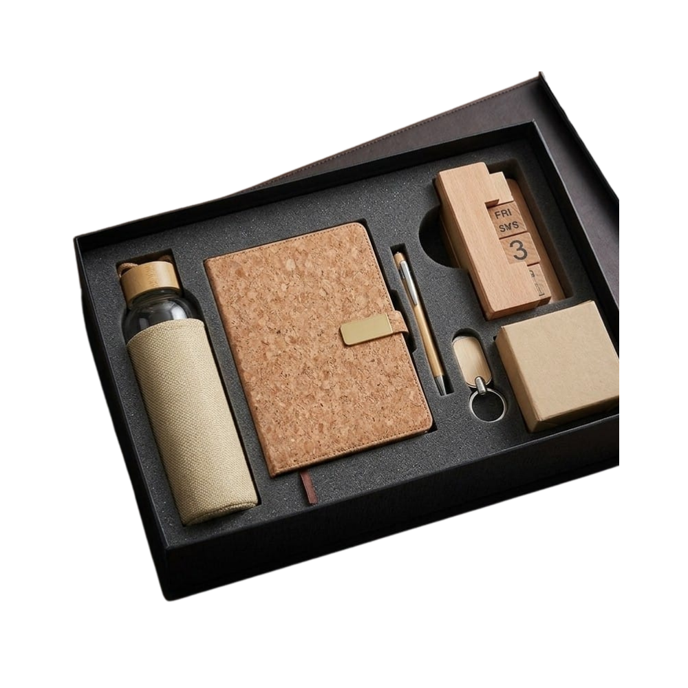 A premium eco-friendly corporate gift set in a black box, containing a cork-wrapped bottle, cork notebook, wooden pen, perpetual calendar, and keychain.