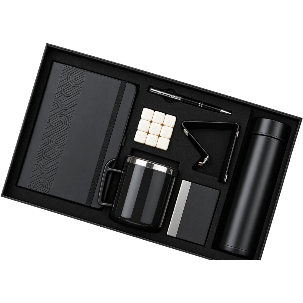 Top-down view of a 6-piece matte black corporate gift set in a presentation box.