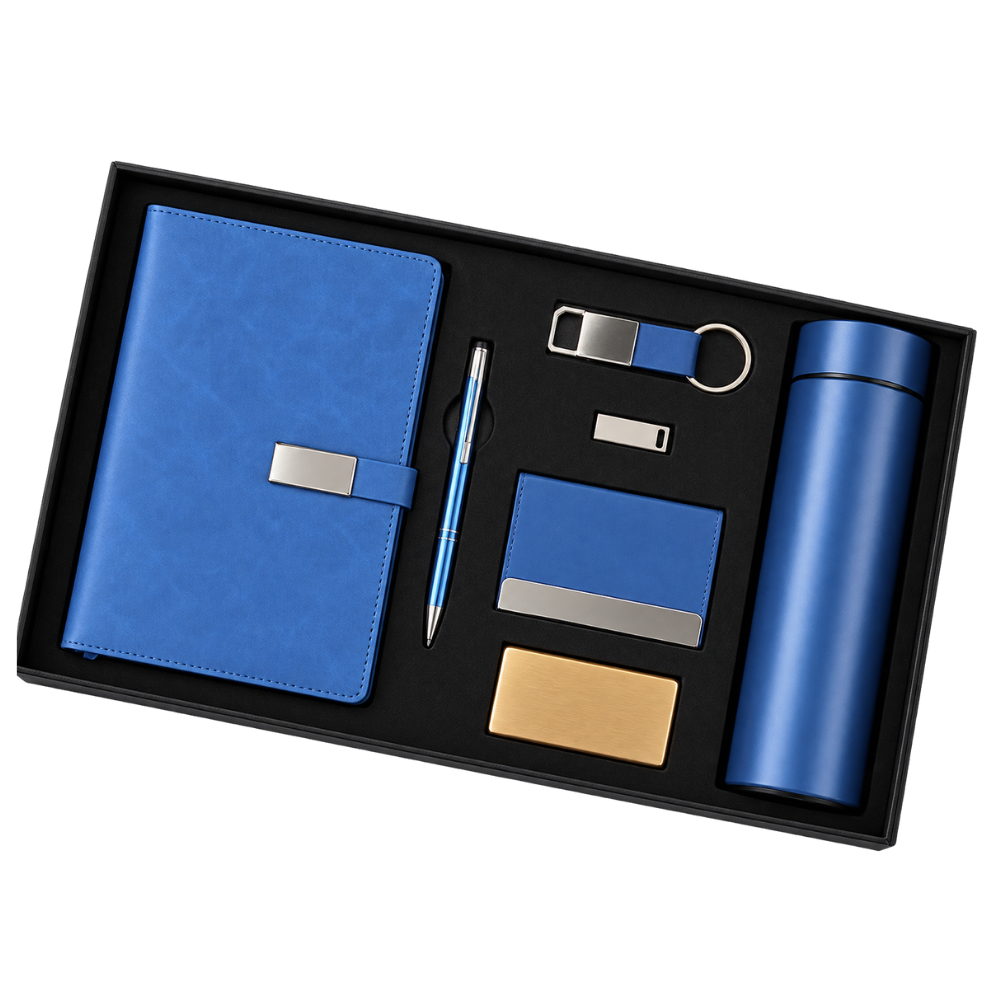 A professional 6-piece blue corporate gift set in a black presentation box, including a notebook, pen, keychain, USB, card holder, and bottle.