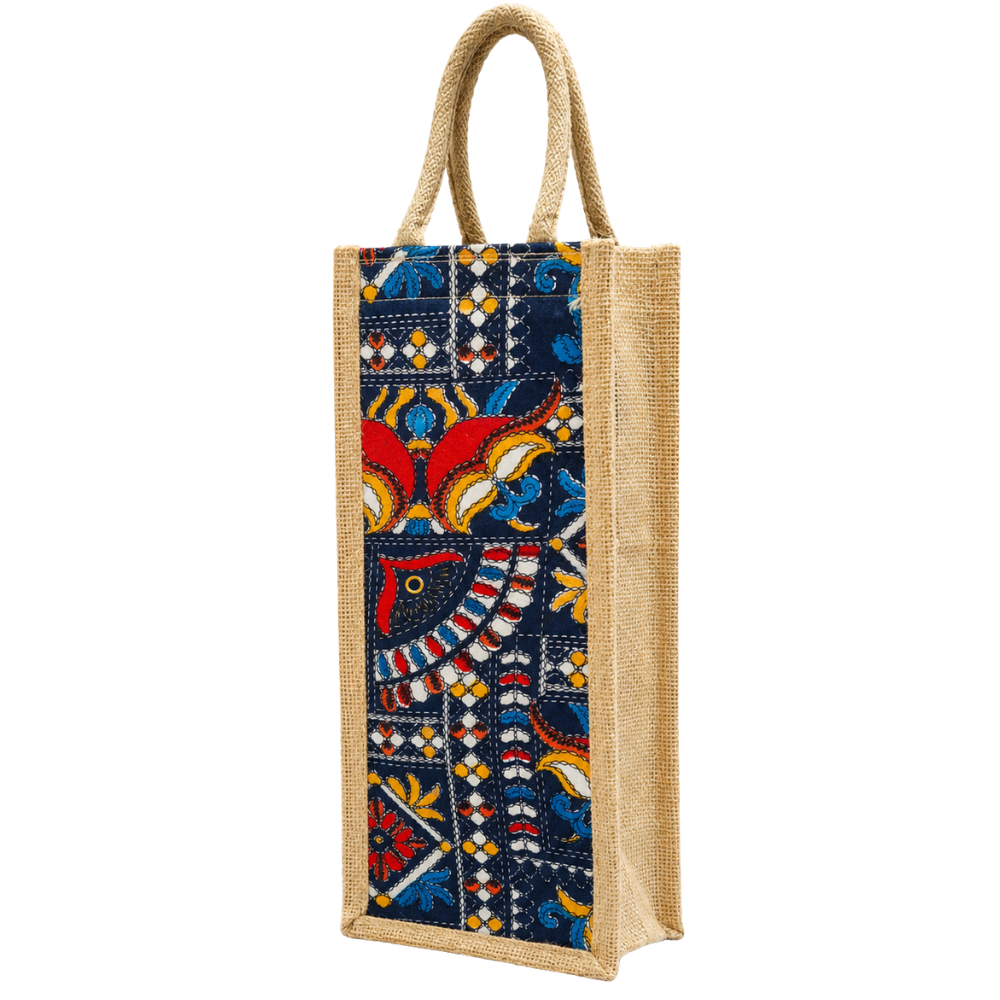 A vertical wine bottle gift bag made of natural tan jute with a colorful patterned fabric front panel and braided jute handles.