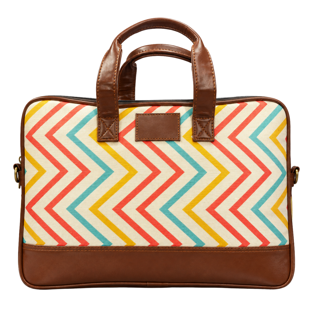 A front view of a laptop briefcase with a colorful chevron pattern and brown faux leather trim.